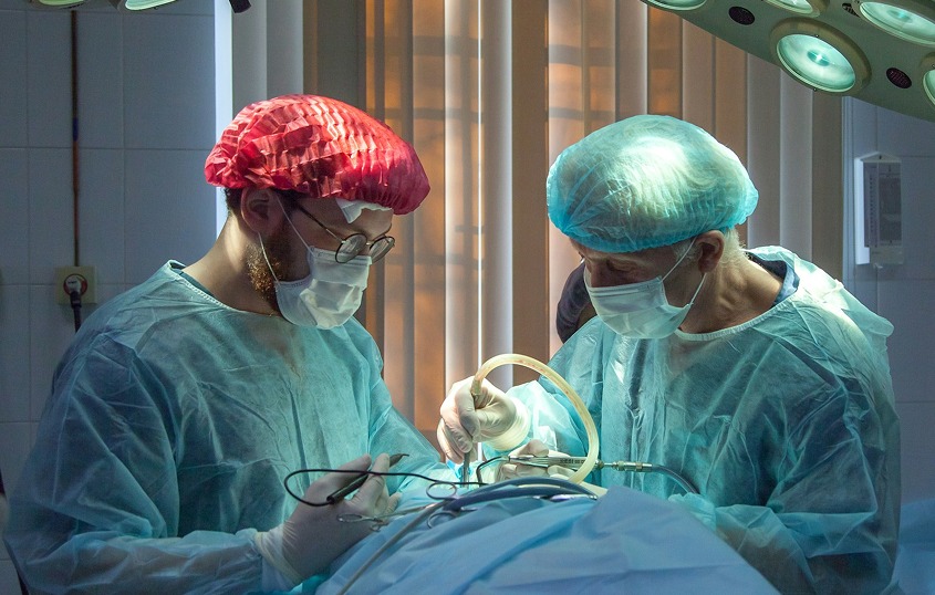 Two surgeons performing surgery in an operating room
